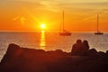 Lovers on the quay near sea at sunset